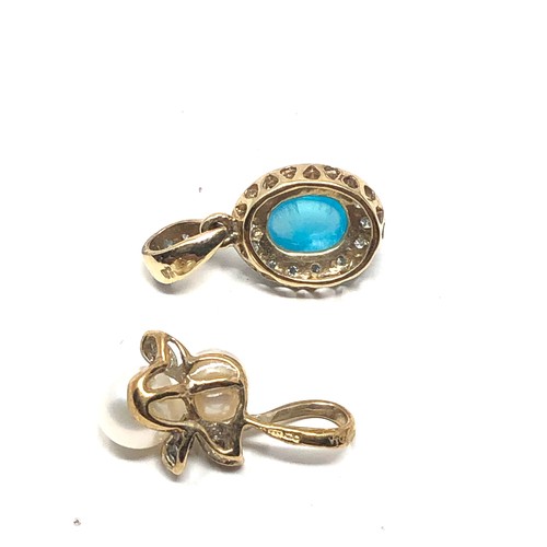 218 - 2 x 9ct gold gemstone & diamond pendants inc. pearl & blue gemstone (2g)