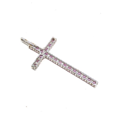 145 - 9ct white gold pink sapphire set large cross pendant (3.4g)