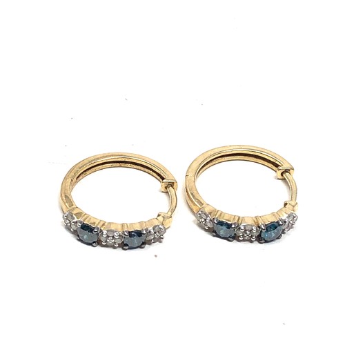 137 - 9ct gold white & enhanced blue diamond hoop earrings (3g)