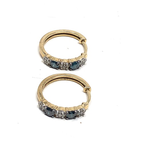 137 - 9ct gold white & enhanced blue diamond hoop earrings (3g)