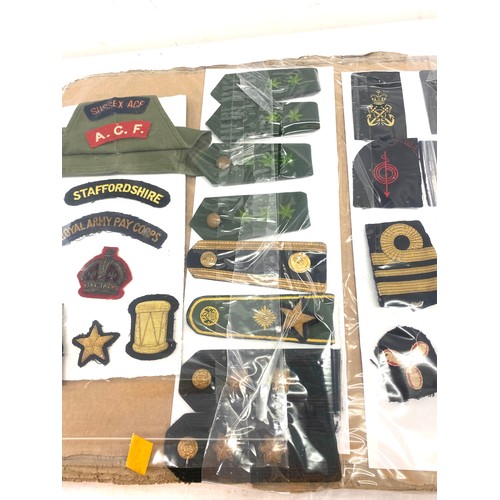 96 - Board of WWII cloth badges