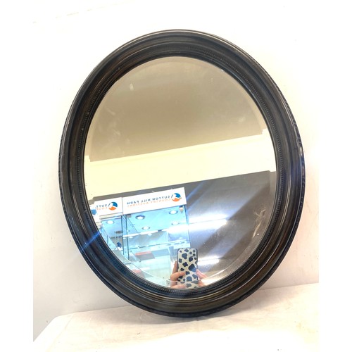 394 - Painted black framed oval beveled edge mirror