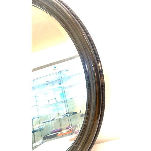 394 - Painted black framed oval beveled edge mirror