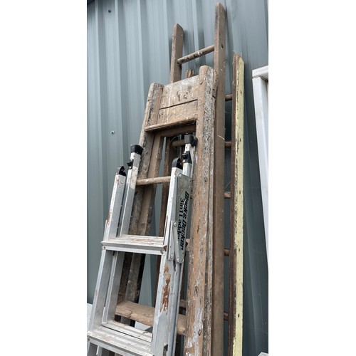 100C - Selection of assorted ladders includes wooden ladders and black and decker ladders