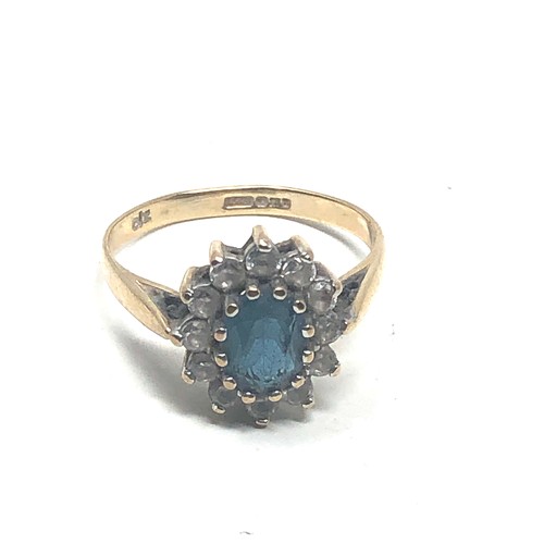 86 - 9ct gold topaz & clear stone ring (2g)