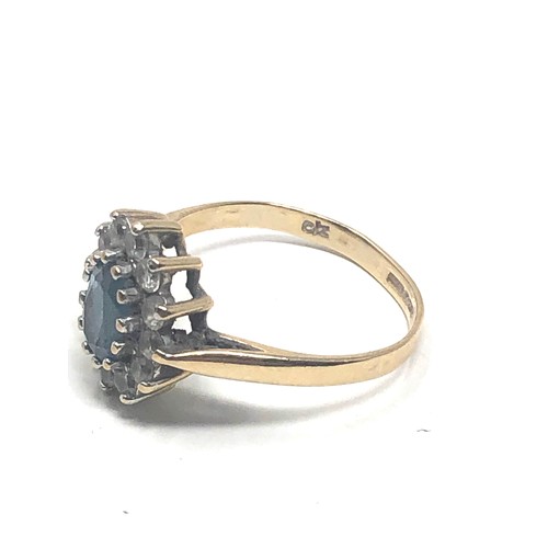 86 - 9ct gold topaz & clear stone ring (2g)