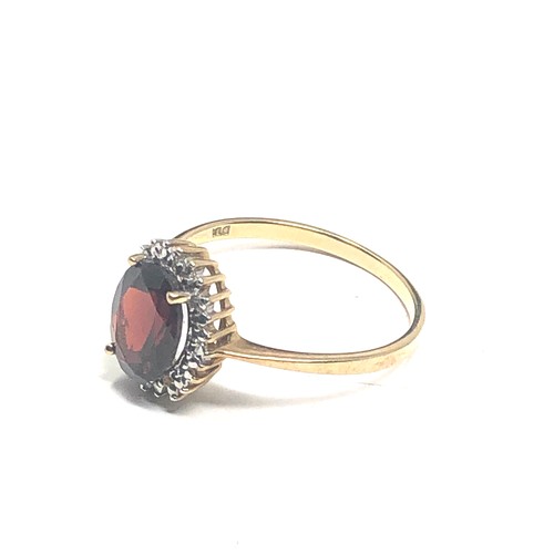 83 - 9ct gold diamond & garnet  ring (1.9g)