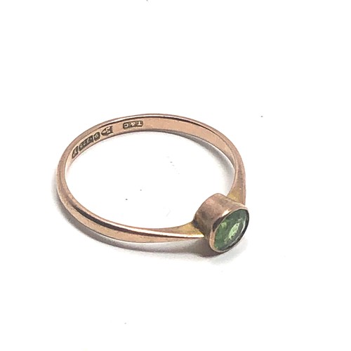 118 - 9ct gold green stone ring  (1.1g)