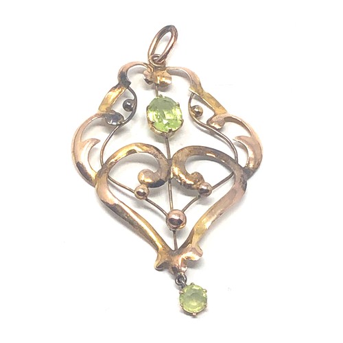 71 - 9ct gold green stone pendant (1.7g)