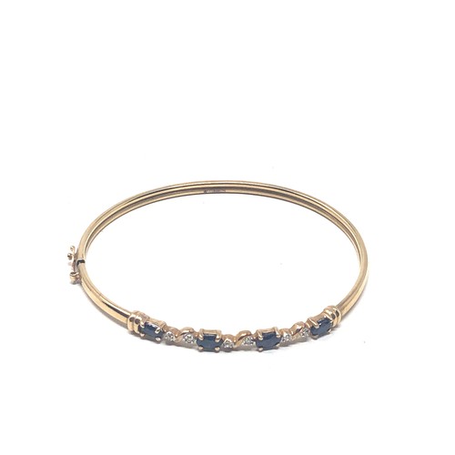 108 - 9ct gold sapphire & diamond bangle (4.3g)