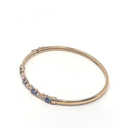 108 - 9ct gold sapphire & diamond bangle (4.3g)