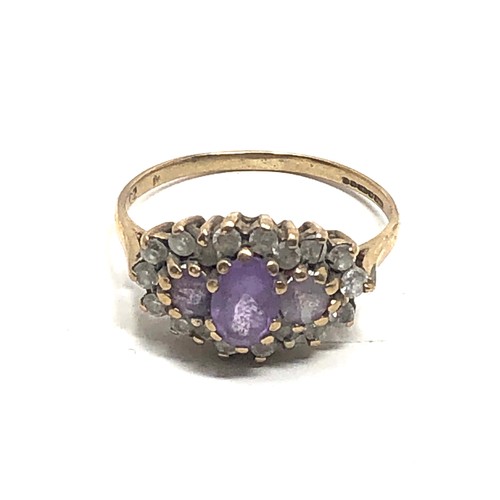 103 - 9ct gold clear stone & amethyst dress ring (2.1g)