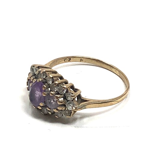 103 - 9ct gold clear stone & amethyst dress ring (2.1g)