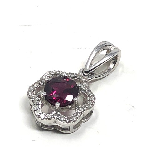 92 - 9ct white gold diamond framed garnet pendant (2g)