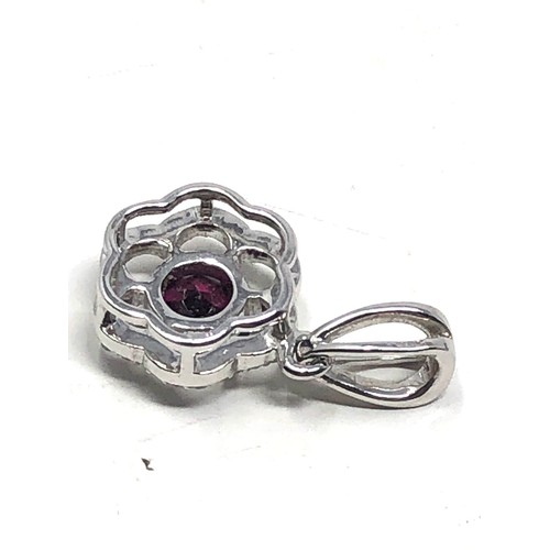 92 - 9ct white gold diamond framed garnet pendant (2g)