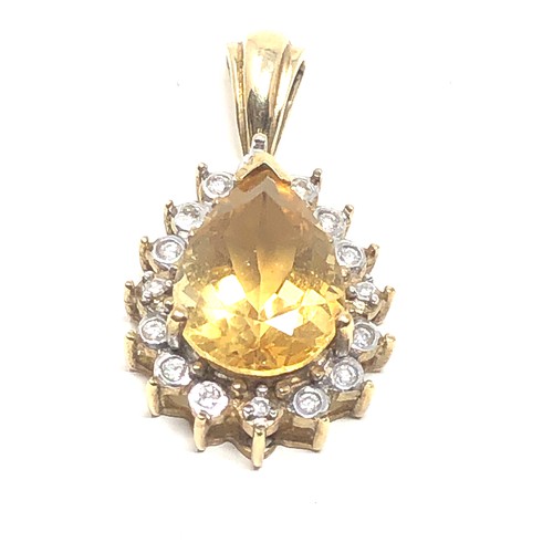 69 - 9ct gold citrine & diamond pendant (3.4g)