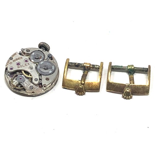 435 - Rolex wristwatch movement and buckles spares or repair