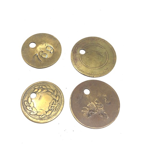 490 - 4 antique brass pit tokens