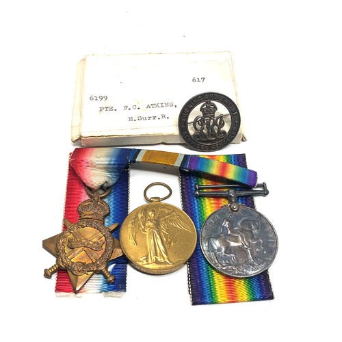 469 - bxed ww1 trio medals & war badge to6199 pte f.c atkins e.surry reg