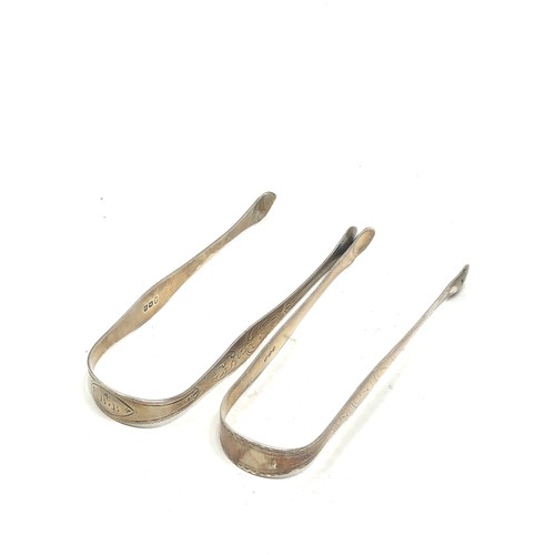 34 - 2 Georgian silver sugar tongs