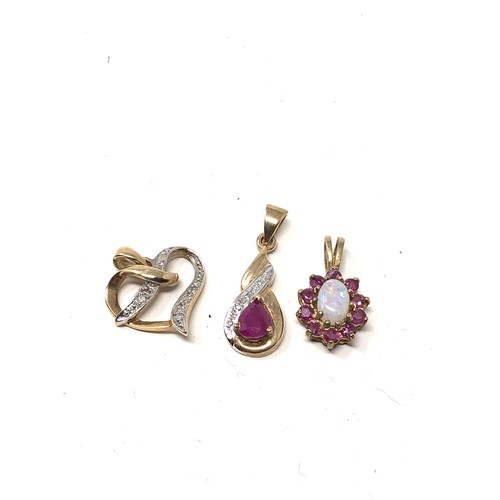 82 - 3 x 9ct gold ruby, opal & diamond pendants (2.6g)