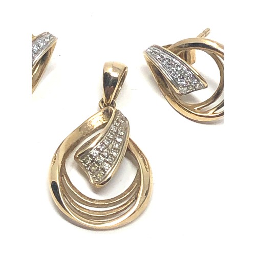 124 - 2 x 9ct gold diamond set pendant & earrings set (3.1g)