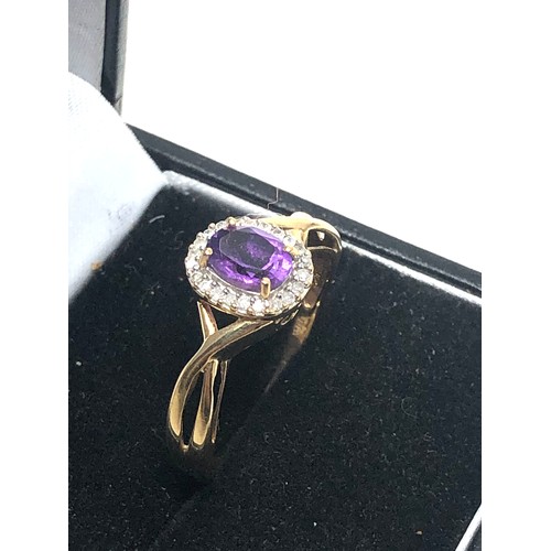 99 - 9ct gold amethyst and diamond halo ring (2.5g)