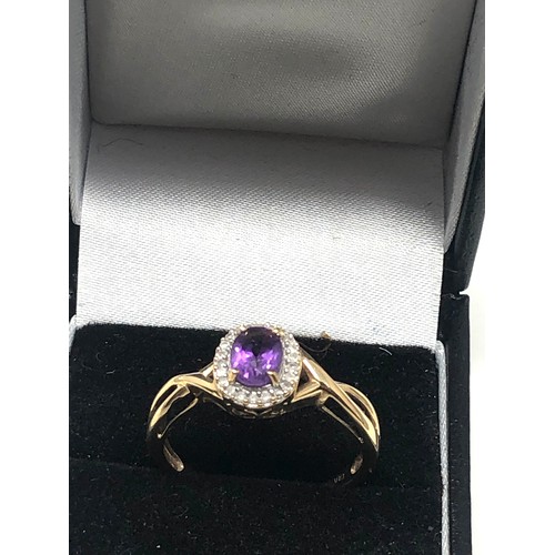 99 - 9ct gold amethyst and diamond halo ring (2.5g)