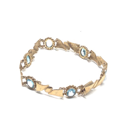 77 - 9ct gold topaz bracelet (11.7g)