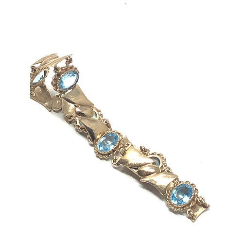 77 - 9ct gold topaz bracelet (11.7g)