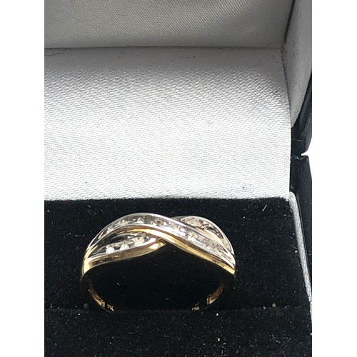 70 - 9ct gold diamond twist band ring (2.2g)