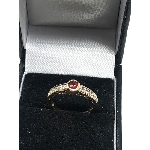 69 - 9ct gold garnet & stone set ring (2.1g)