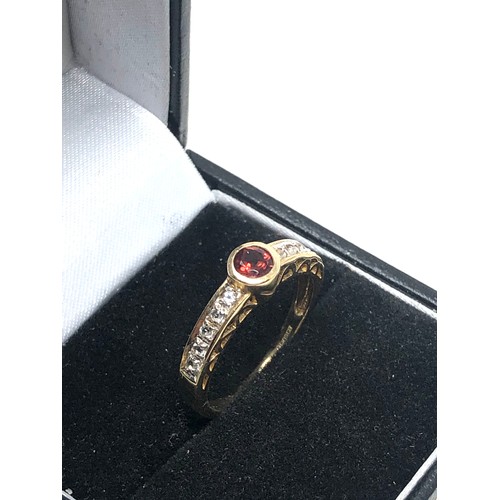 69 - 9ct gold garnet & stone set ring (2.1g)