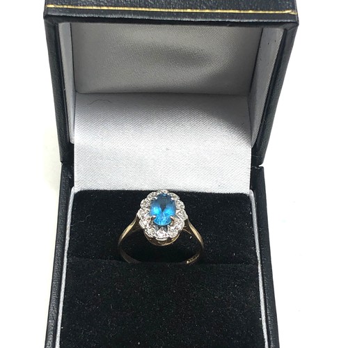 97 - 9ct gold diamond topaz ring (2g)