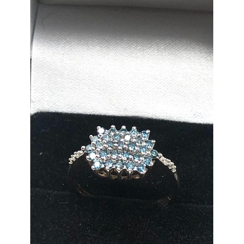 94 - 9ct gold diamond & enhanced blue diamond ring (2.2g)