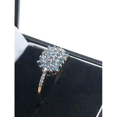 94 - 9ct gold diamond & enhanced blue diamond ring (2.2g)