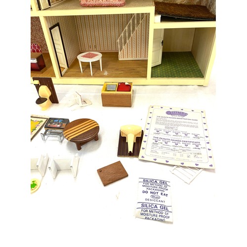 333 - Children's plastic dolls house with furniture