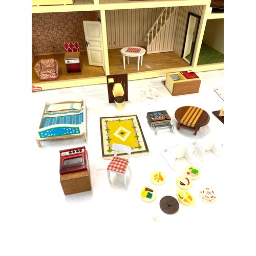 333 - Children's plastic dolls house with furniture