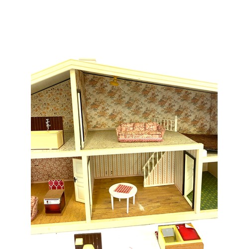 333 - Children's plastic dolls house with furniture