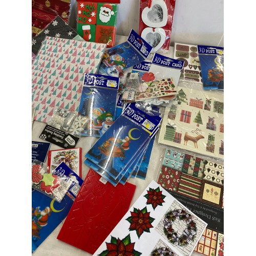 255 - A selection of assorted Christmas craft items to include post cards, foam stamps etc