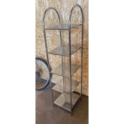 320 - Silver shelving unit measures approx 56 inches tall 14 inches wide 11.5inches depth