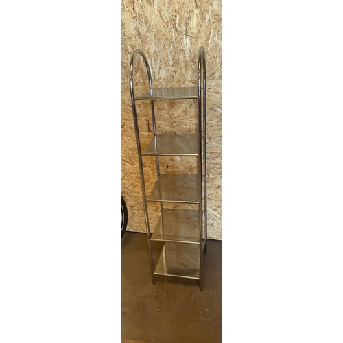 320 - Silver shelving unit measures approx 56 inches tall 14 inches wide 11.5inches depth