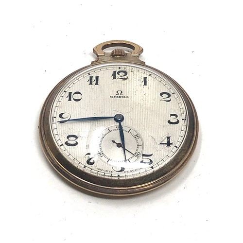 466 - Omega open face pocket watch gold plated case  the watch is ticking