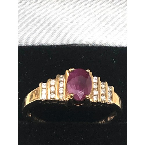 90 - 9ct gold ruby & diamond ring central ruby measures approx 7mm by 5.5 with diamonds either side weigh... 