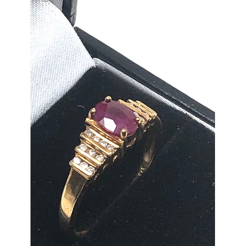 90 - 9ct gold ruby & diamond ring central ruby measures approx 7mm by 5.5 with diamonds either side weigh... 