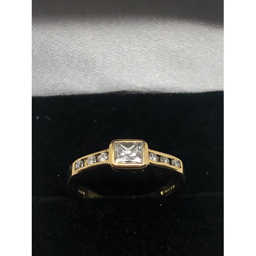 108 - fine 18ct gold emerald cut diamond ring the central  diamond measures appox 4mm by 3mm with 3 diamon... 