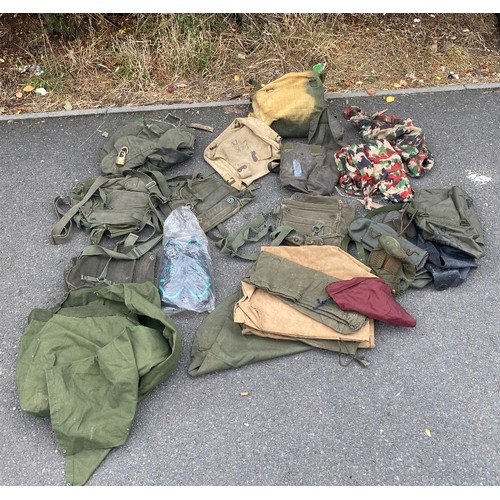 336 - Large bag of military surplus to include clothing, camouflage, rucksacks, bags etc