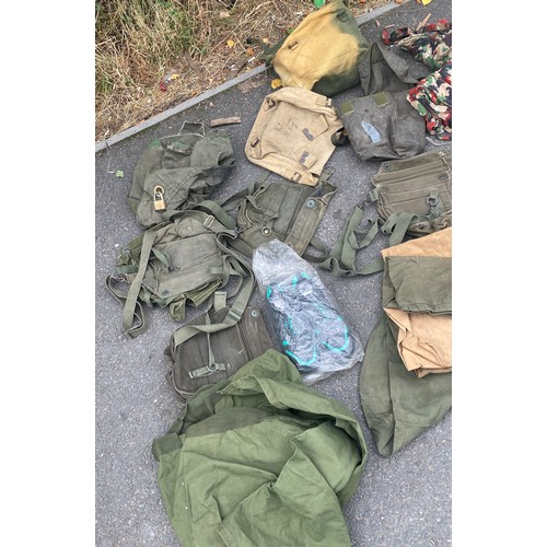 336 - Large bag of military surplus to include clothing, camouflage, rucksacks, bags etc