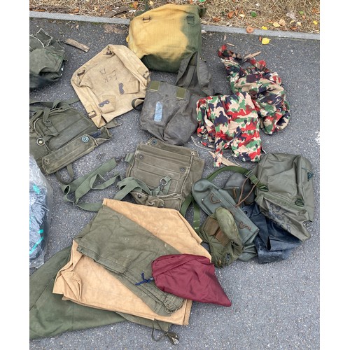 336 - Large bag of military surplus to include clothing, camouflage, rucksacks, bags etc