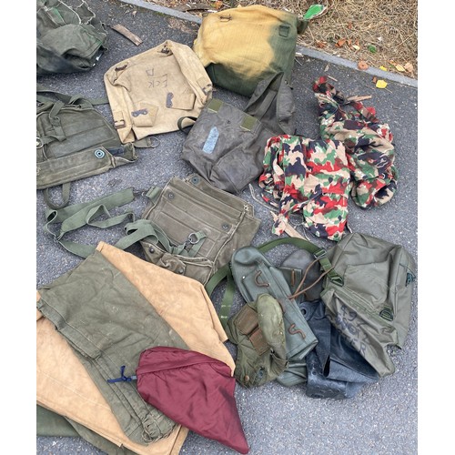 336 - Large bag of military surplus to include clothing, camouflage, rucksacks, bags etc